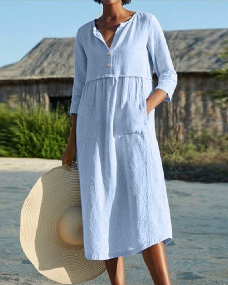 AD | Chic sommarmidiklänning i luftigt bomullsmaterial med elegant knappslå