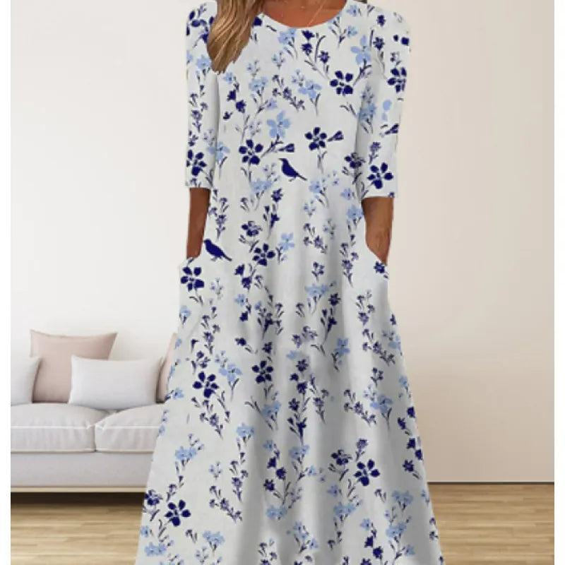 AD | Linneklänning med fickor och blommigt tryck i akvarellstil