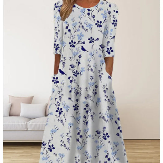 AD | Linneklänning med fickor och blommigt tryck i akvarellstil