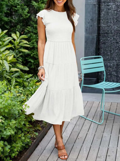 AD | Elegant sommarklänning med plissering och volanger