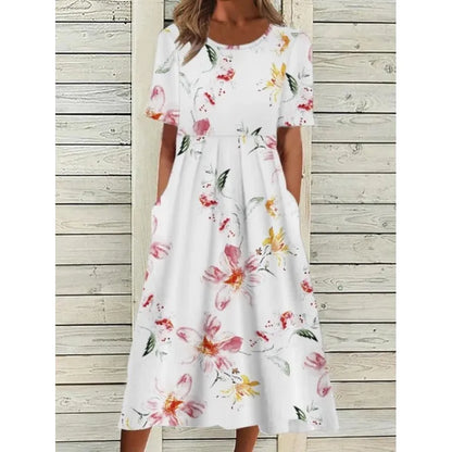 AD | Linneklänning med fickor och blommigt tryck i akvarellstil