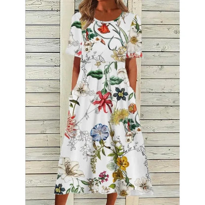 AD | Linneklänning med fickor och blommigt tryck i akvarellstil