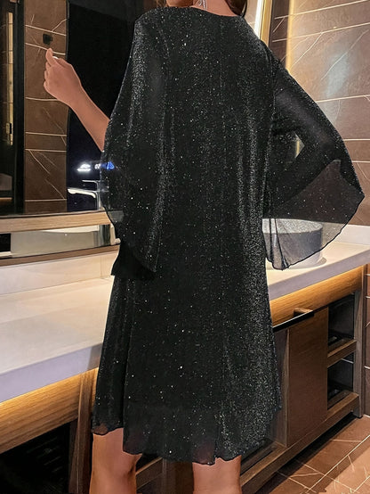 AD | Elegant glitterklänning med V-ringning och slitsade ärmar