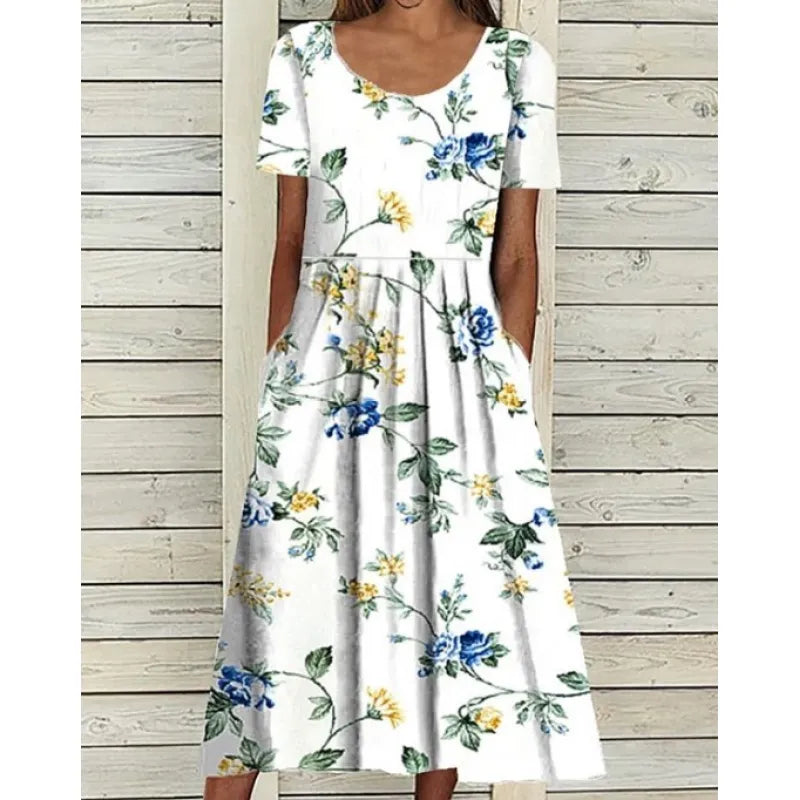 AD | Linneklänning med fickor och blommigt tryck i akvarellstil