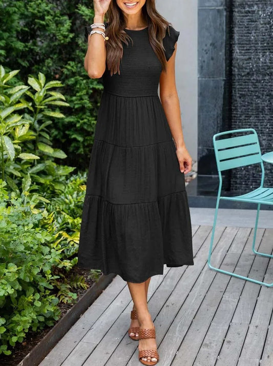 AD | Elegant sommarklänning med plissering och volanger