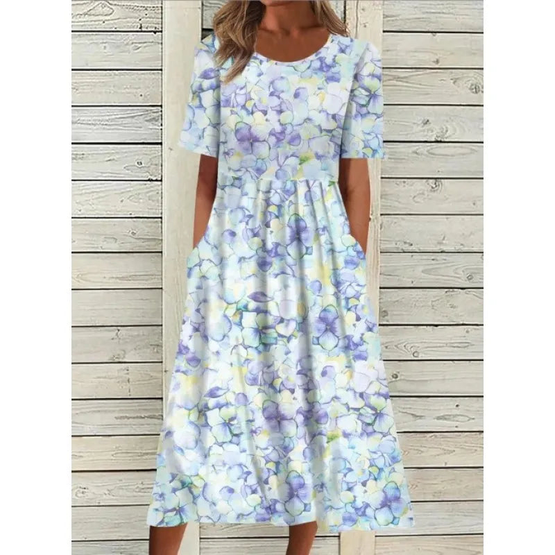 AD | Linneklänning med fickor och blommigt tryck i akvarellstil