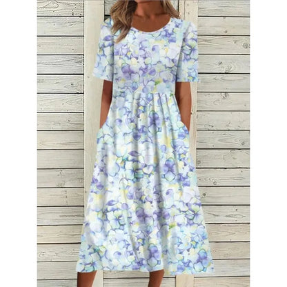 AD | Linneklänning med fickor och blommigt tryck i akvarellstil