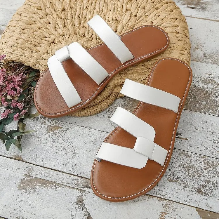 AD | Platta sandaler med öppen rygg och spänne